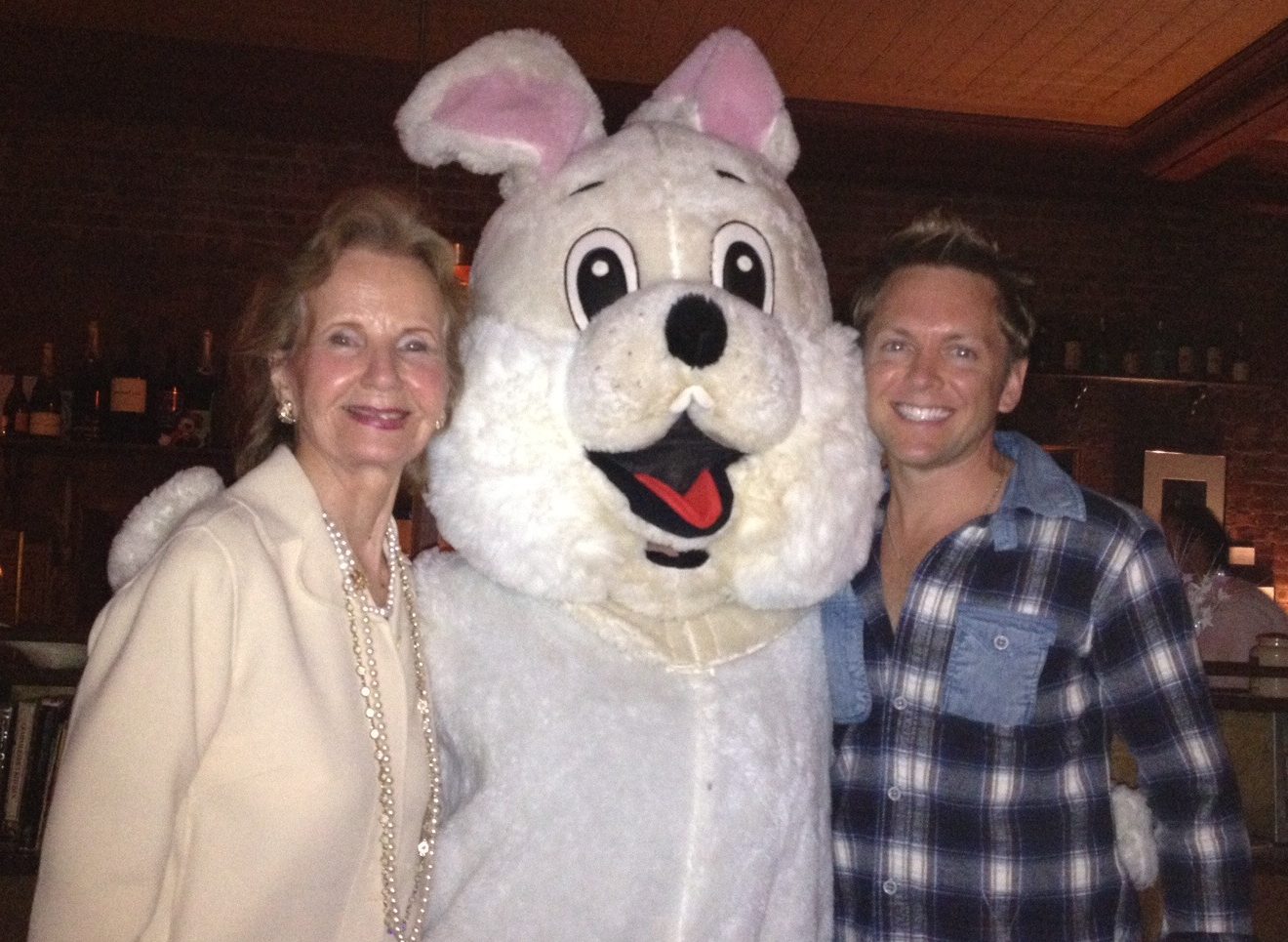 People posing with giant rabbit costume