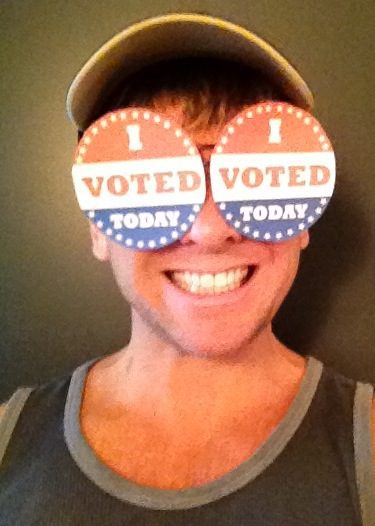 Smiling voter with novelty glasses