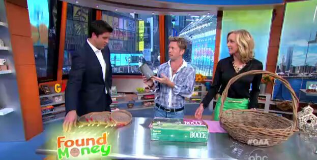 Hosts examining vintage items on show