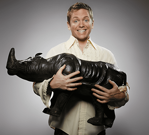 Happy person carrying rhino model.