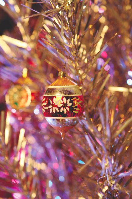 Colorful ornament on Christmas tree branch