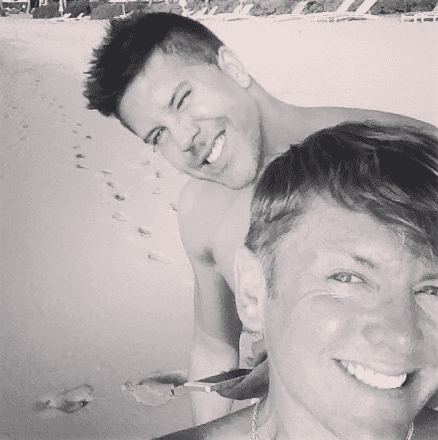 Two people smiling on a beach