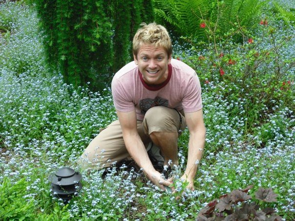 Person tending plants in a garden