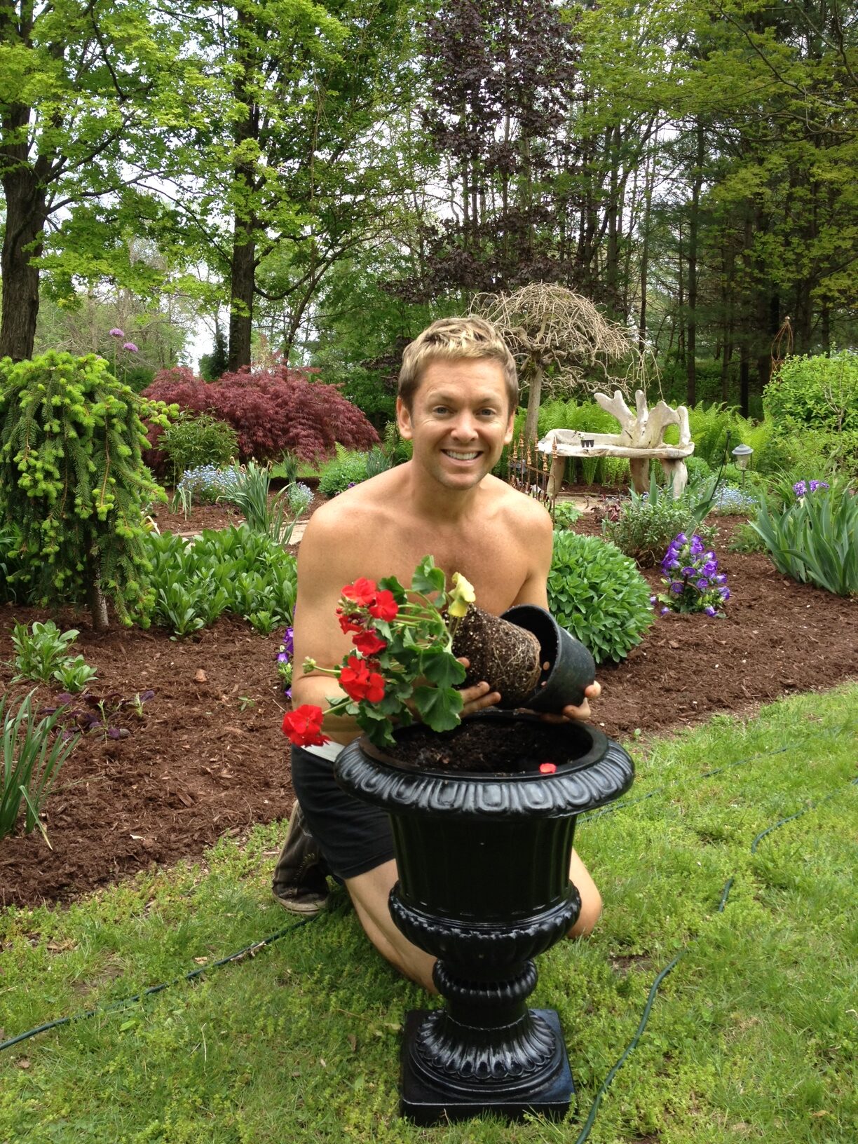 Person arranging plants outdoors