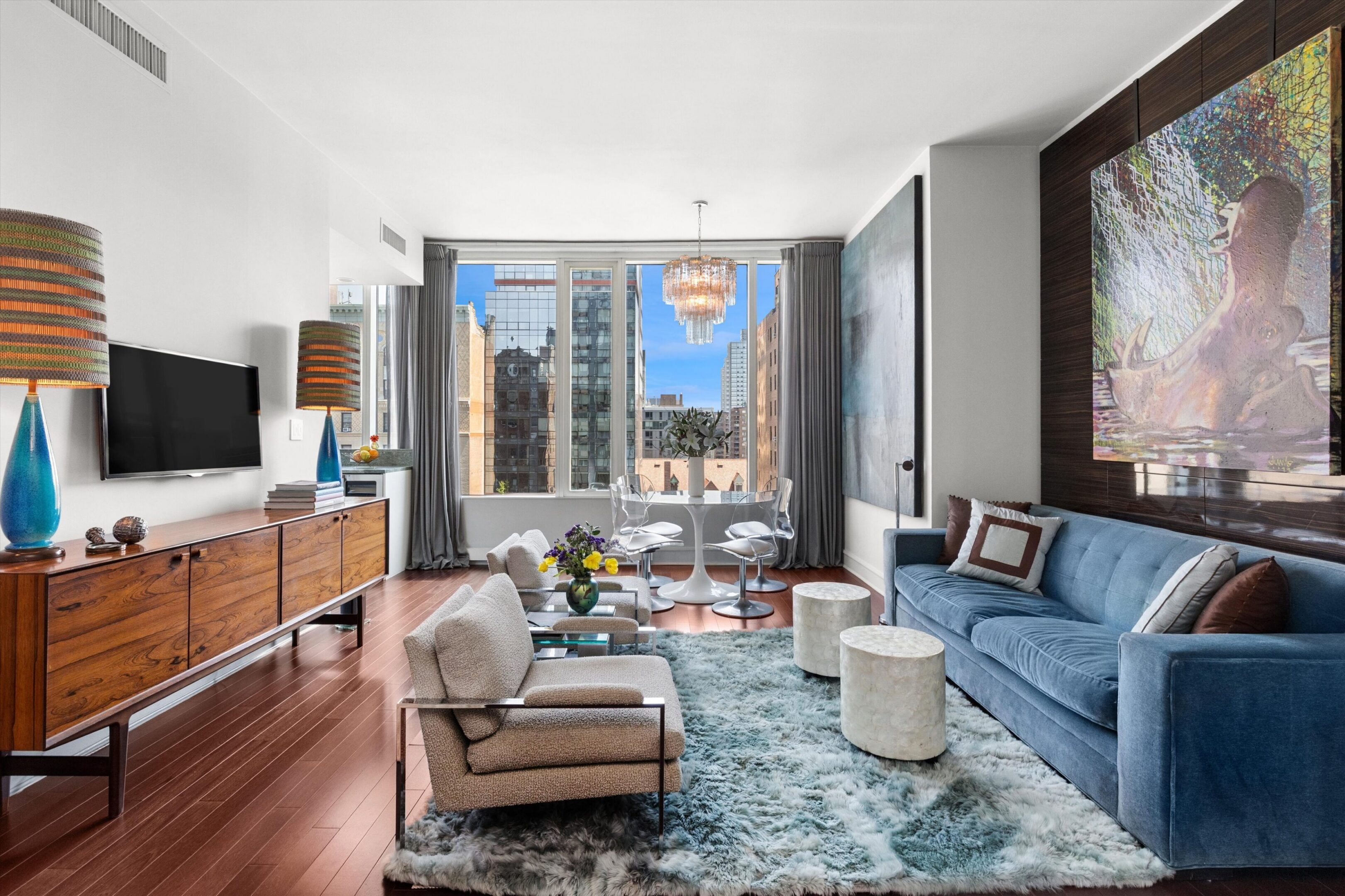 Modern living room with city view window.