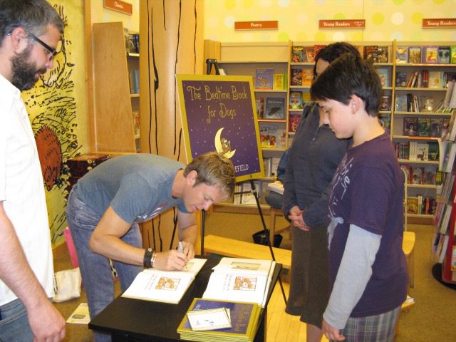 Book signing event at a bookstore.