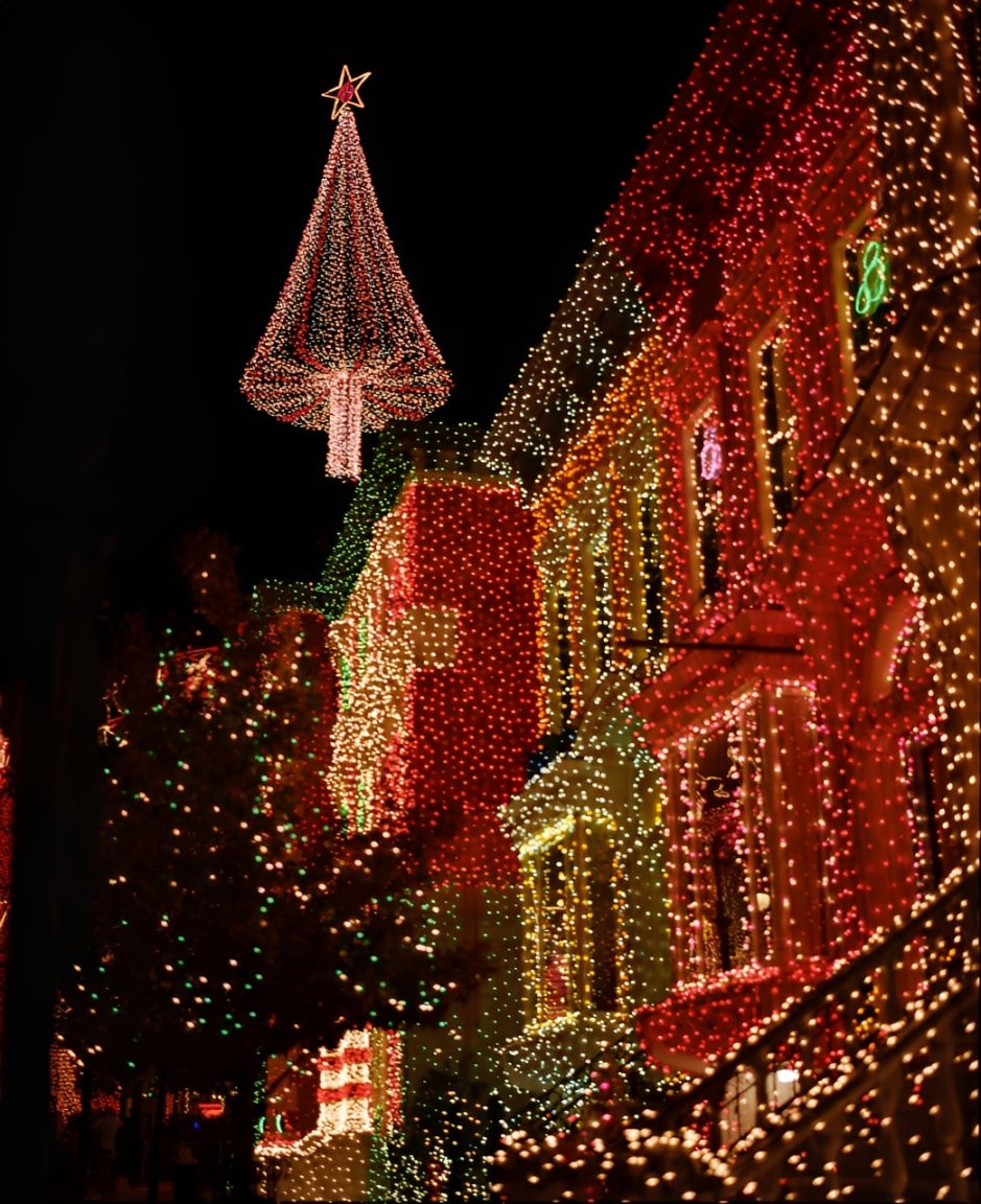 Buildings adorned with colorful Christmas lights.