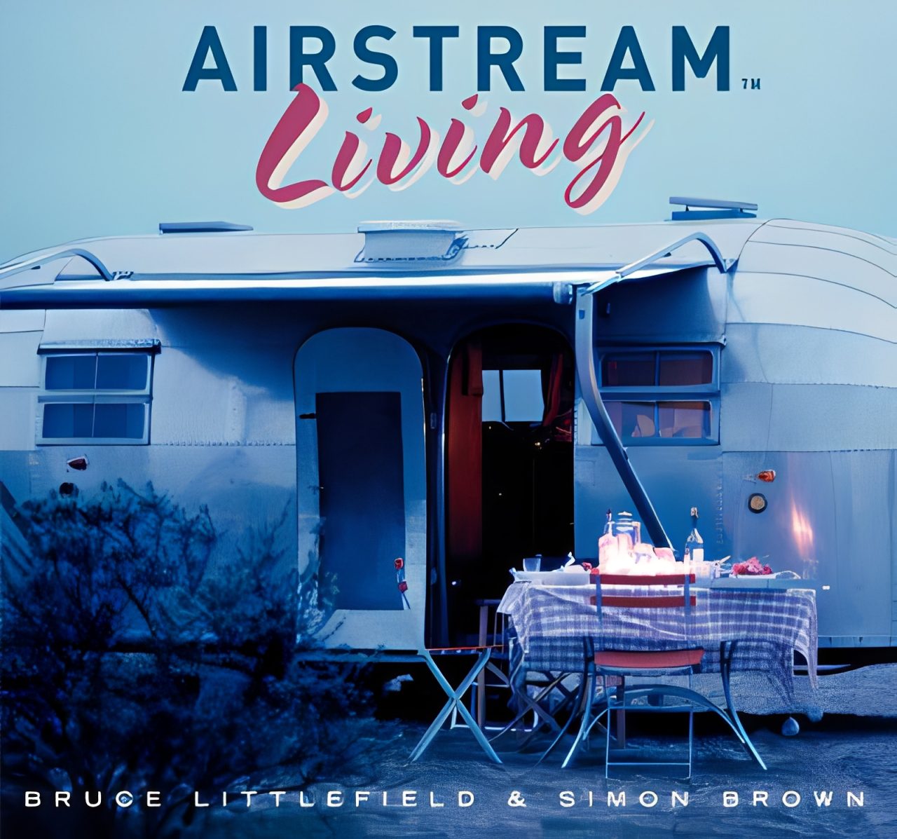 Airstream trailer with outdoor dining setup.