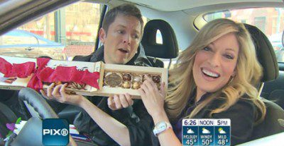 People sharing chocolates in a car