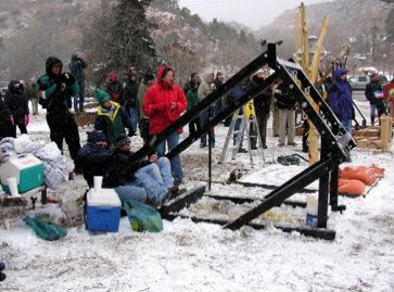 People watching outdoor event in snowy weather