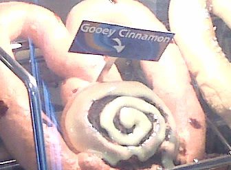 Gooey cinnamon roll in display case