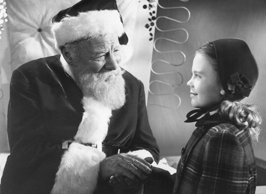 Santa and girl sharing a moment