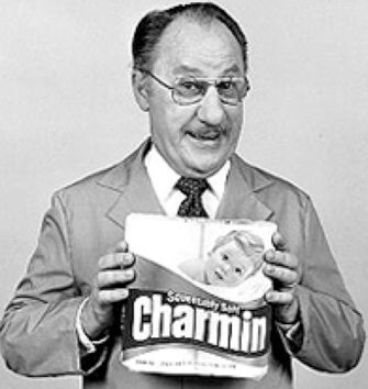 Smiling man with Charmin product