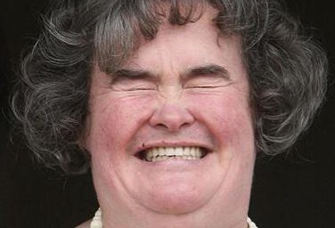 Woman laughing with closed eyes