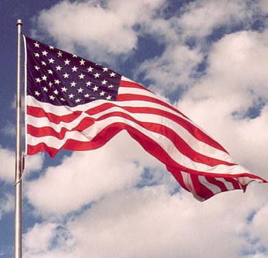 Stars and stripes with clouds background