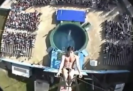 Diver above circular pool