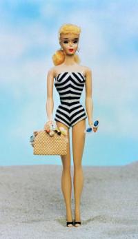 Doll holding sunglasses and handbag