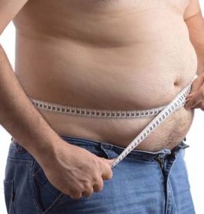Man checking waist size with tape
