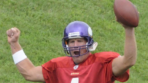Football player celebrating with raised arms