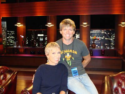 Two people posing in a studio