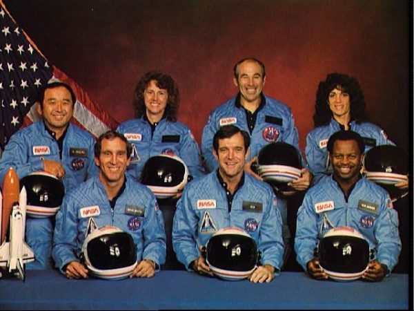 Astronauts in blue NASA uniforms