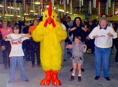 Group dance with chicken mascot