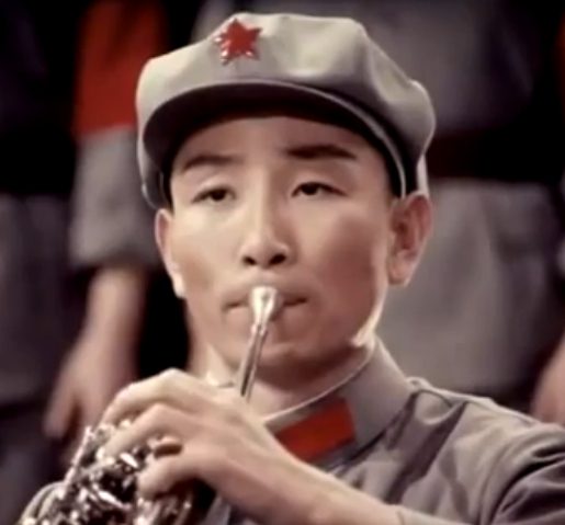 Man with horn wearing a cap