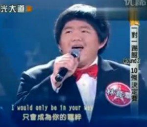 Singer performing on stage with microphone