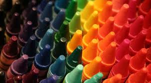 Colorful crayons arranged in rainbow order