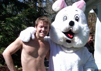 Shirtless man with Easter bunny mascot