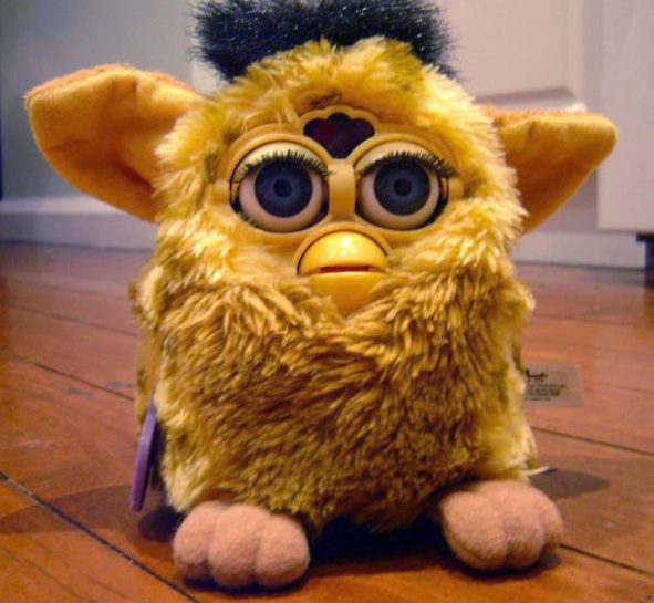 Yellow furry toy with big eyes