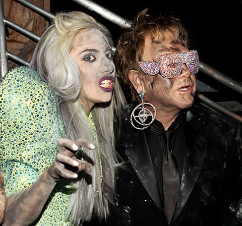 Glamorous pair posing in unique attire.