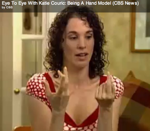 Woman displaying hands in interview