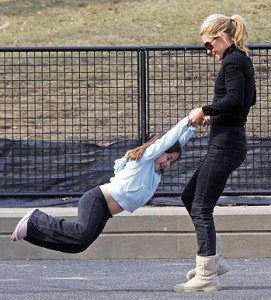 Mother and daughter playing outdoors