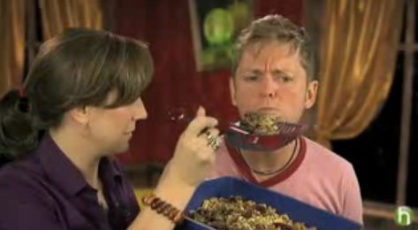 Man hesitates to eat strange meal.