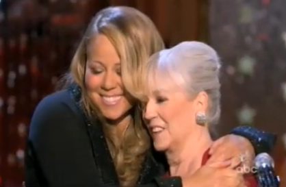 Two women embracing on stage