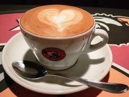 Coffee cup with heart-shaped foam art