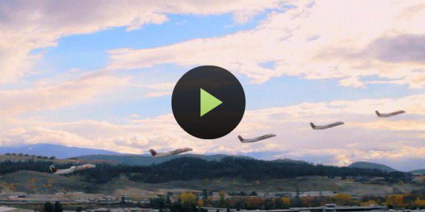Airplanes flying over scenic landscape