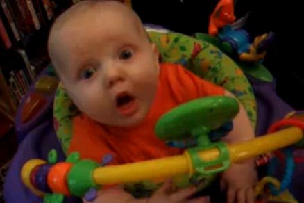 Baby in colorful activity center