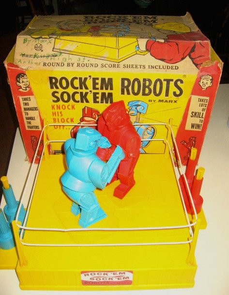 Colorful boxing robots in toy ring