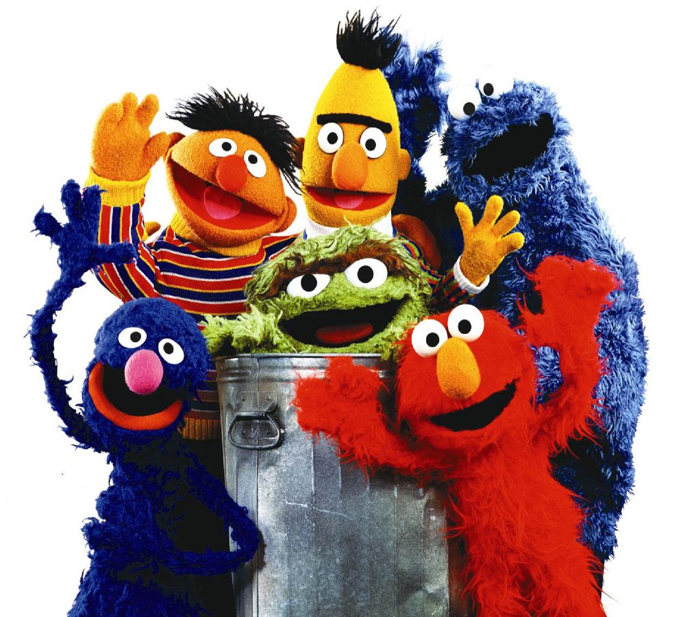 Colorful puppets posing together happily