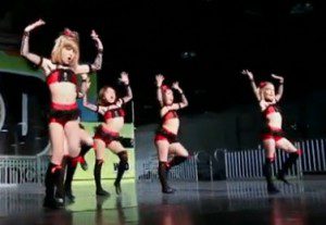 Young dancers on stage in costumes