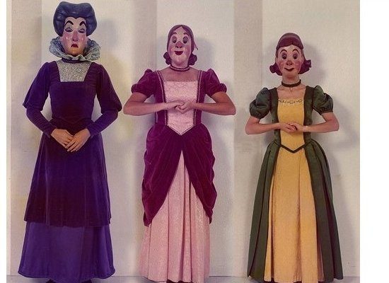 Characters in colorful theatrical costumes