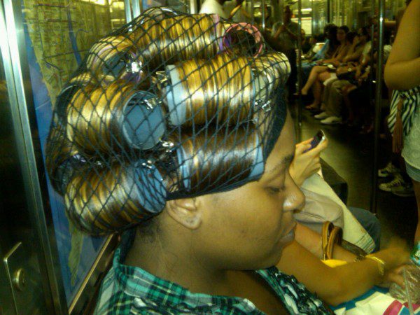 Commuter with hair rollers sleeping