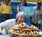 Competitive eater devours multiple hot dogs