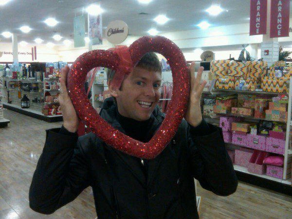 Smiling man with heart-shaped frame