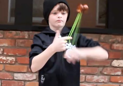 Young boy mastering yo-yo skills