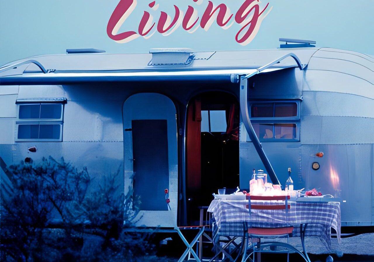 Airstream trailer with outdoor dining setup.