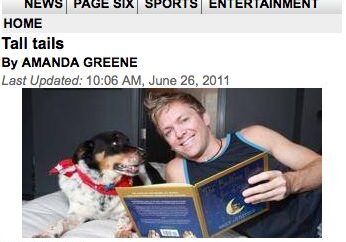 Dog and man enjoying a book