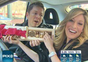 People sharing chocolates in a car